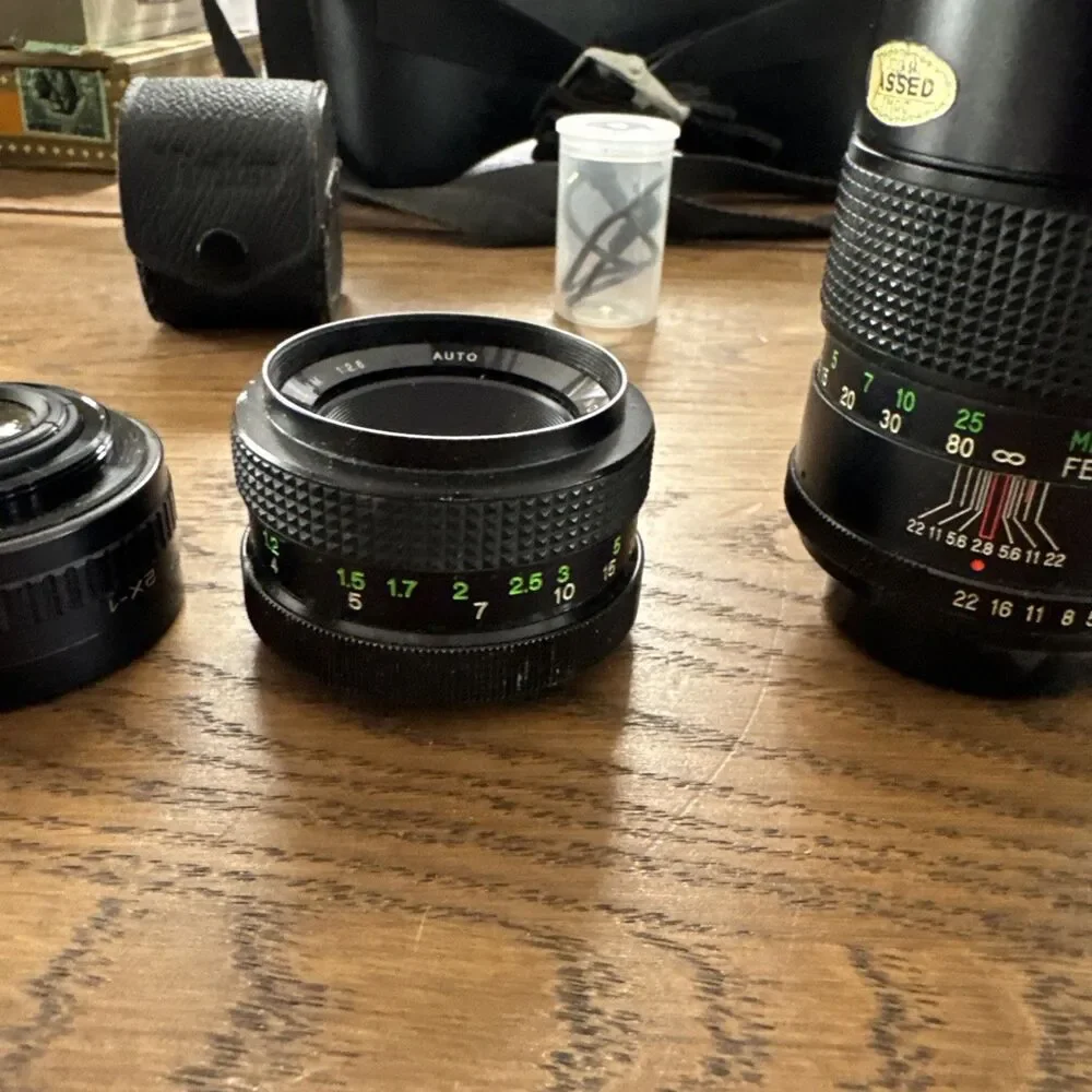 vintage Vivitar hard-sided black camera case And Vivitar camera accessory lot